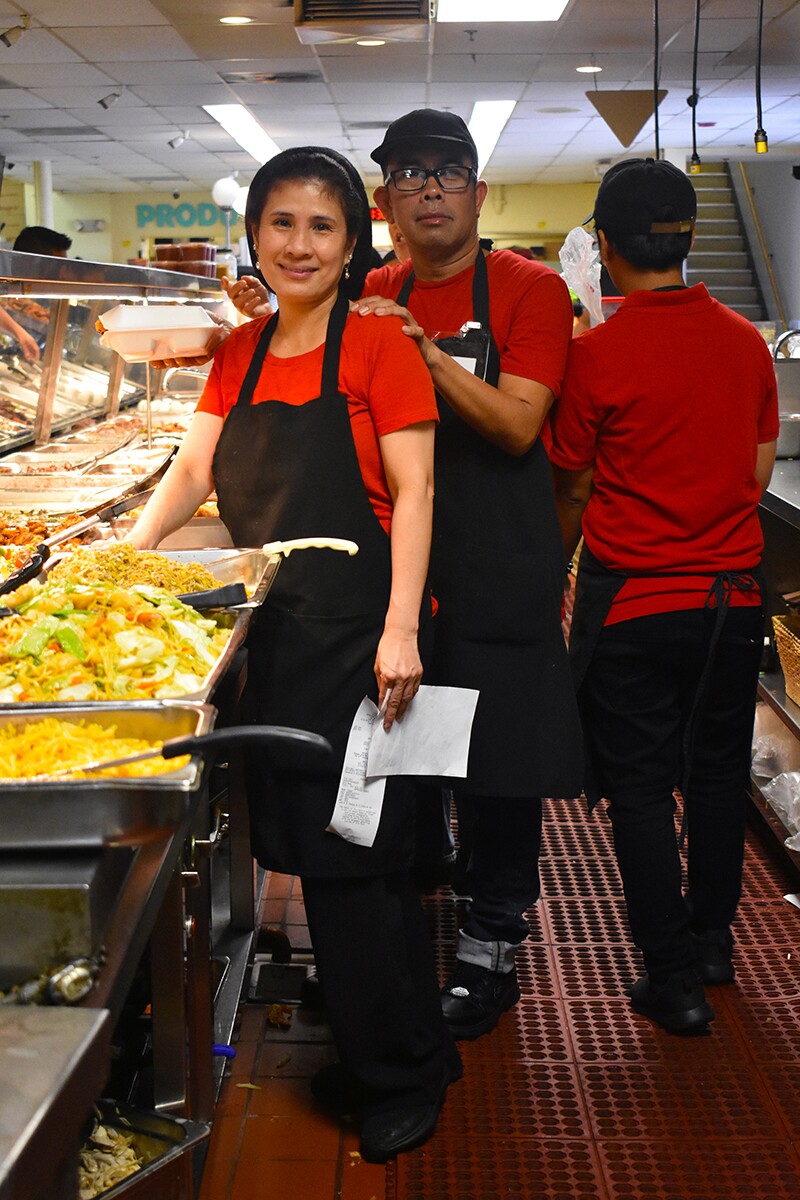 Workers pose for a picture in the turo-turo section. | Jacqueline Lee