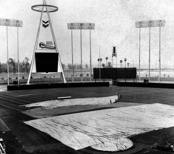 As this 1967 of a rain-delayed game shows, the stadium originally featured no bleachers or grandstands beyond the outfield. Courtesy of the Herald-Examiner Collection, Los Angeles Public Library.