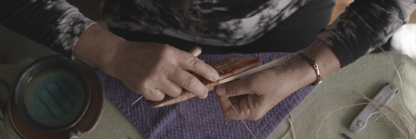 Linda Yamane making a basket | Still from KCET Artbound's "The Art of Basket Weaving"