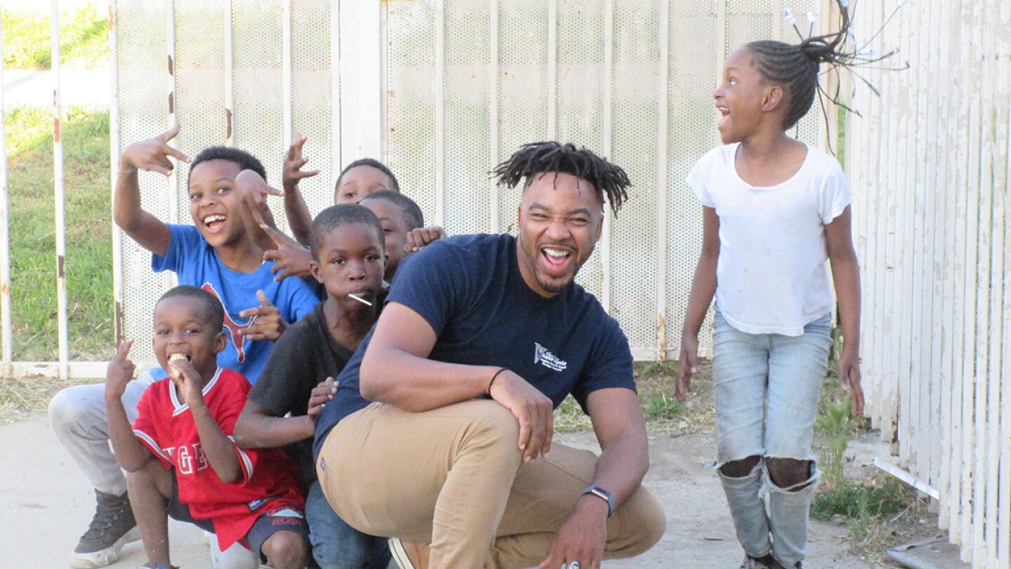 Bruce Lemon Jr. playing with youth during a rehearsal break