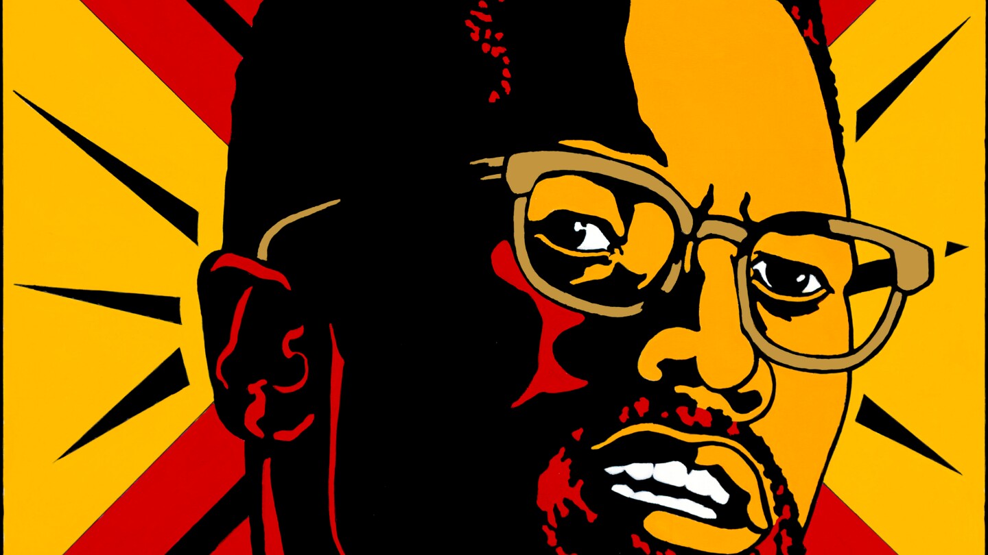 A graphic design poster of Malcolm X made by Emory Douglas.