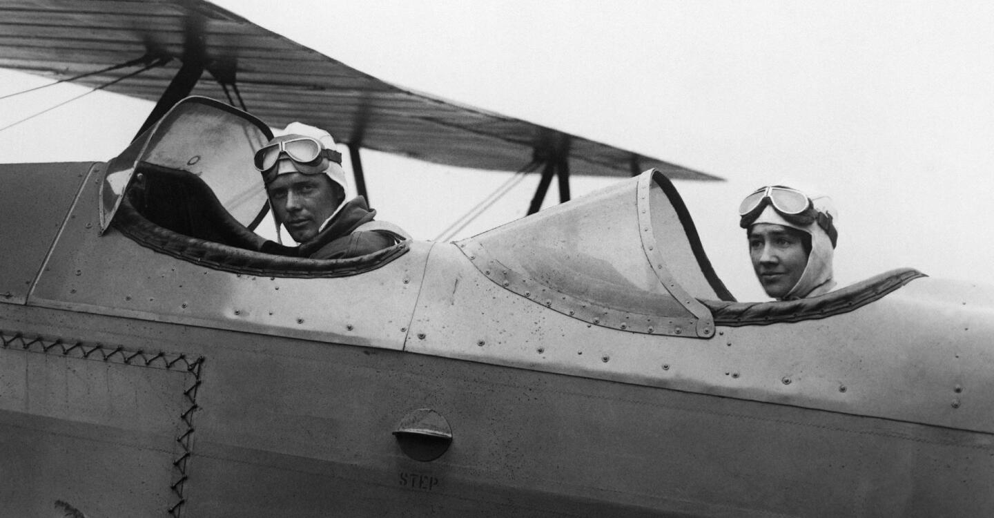 Charles Lindbergh and Anne Morrow Lindbergh seated in a small plane. | From "You'll Have the Sky: The Life and Work of Anne Morrow Lindbergh"