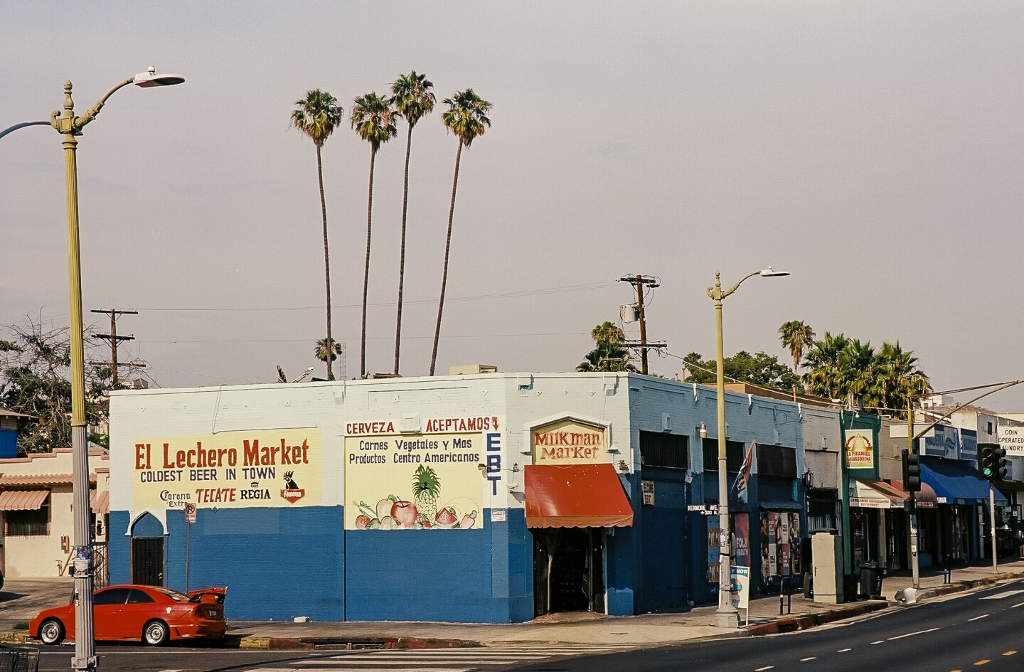A mercado on Beverly Boulevard in East Hollywood dons hand painted signs advertising produce, beer and milk.