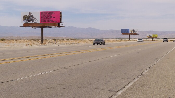 Xaviera Simmons' "Because You Know Ultimately We Will Band A Militia" is a series of billboards along Gene Autry Trail as part of Desert X 2021.