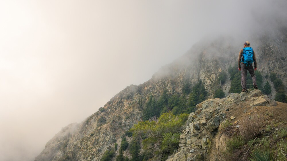 Hiker contemplates the foggy abyss in the San Gabriels | Photo: Mason Cummings/The Wilderness Society
