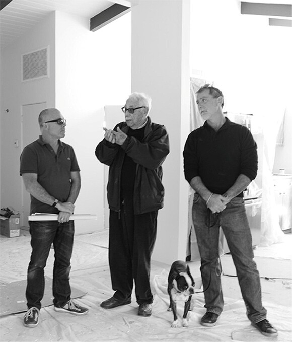 Menrad, Krisel, an unidentified Boston terrier, and Roberts observe the construction. | Photo: Patricia Peterson.