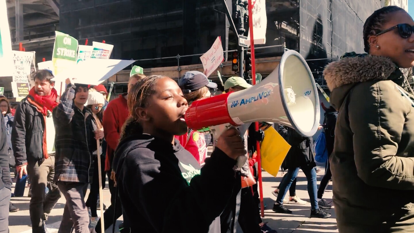 In Oakland, Jae Hill from the organization Youth Together joins teachers’ strikes to support funding for pay and to maintain the health and counseling services that she and her fellow students need to succeed in school.