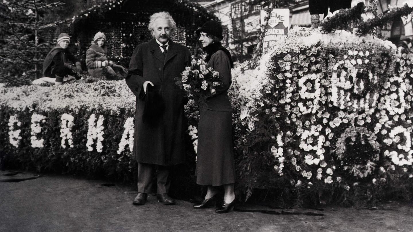 Dr. Albert Einstein took time out from his research to inspect the prize winning float in the 1932 Rose Parade. The float represented a scene in the Black Forest of Germany. | Photo Getty Images / Bettman