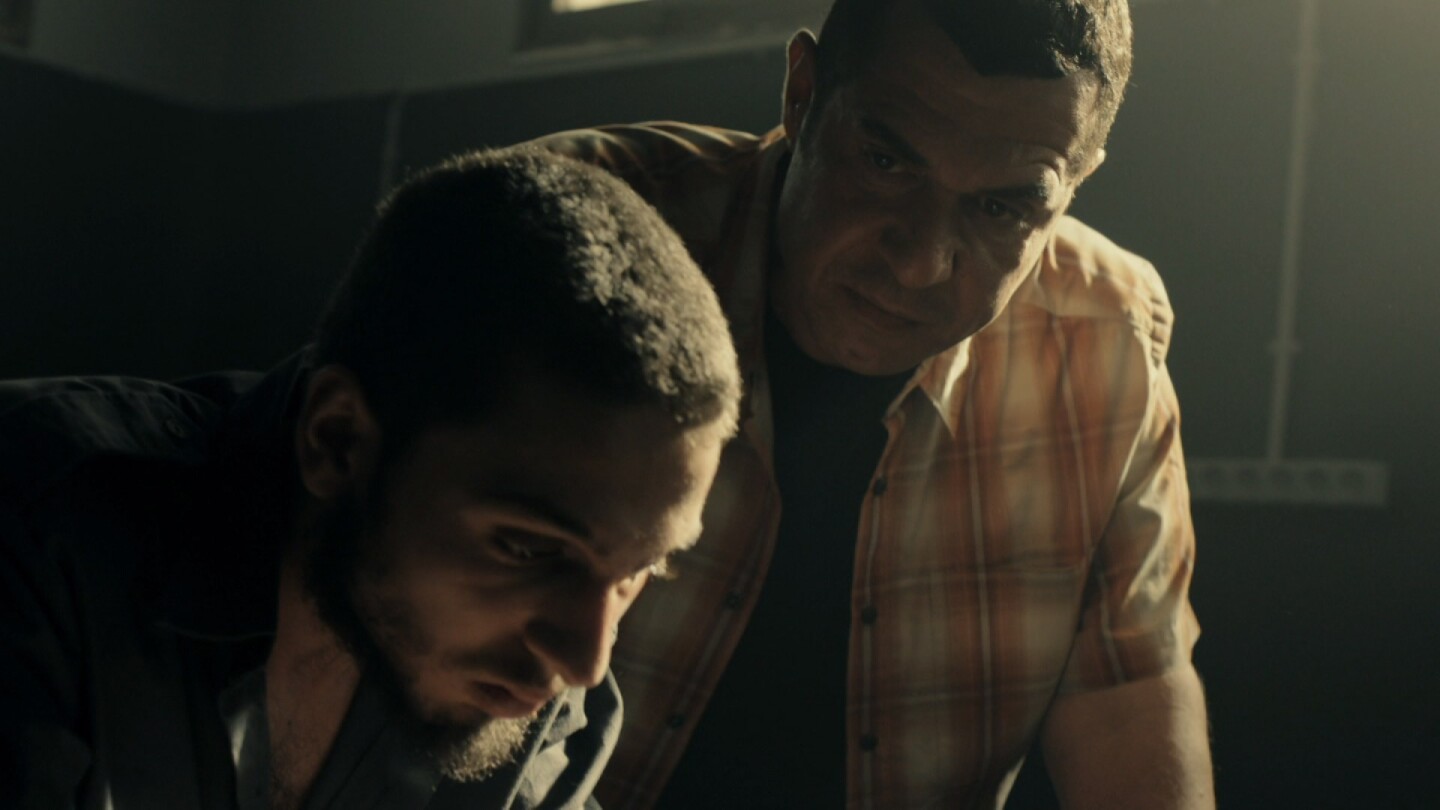Two men are side by side and hunched over. | From "Fauda: S2 E8"
