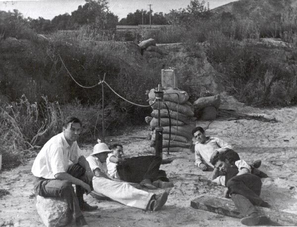Rocket engine experimenters take a break. Rudolph Schott, Apollo Milton Olin Smith, Frank Malina (white shirt, dark pants), Ed Forman and Jack Parsons (right, foreground). Nov. 15, 1936 | Photo: JPL/NASA