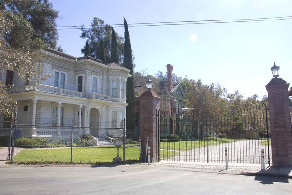 The Perry Masion viewed through the Heritage Square Museum gates.