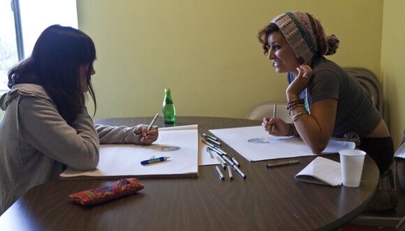 Artist Diana Garcia and Eva, one of her partnered SPY youths.