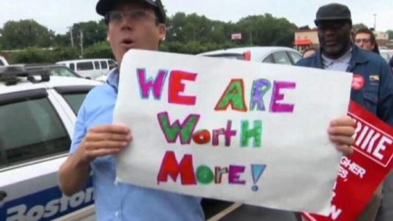 Workers protest low pay, but some argue increases kill jobs