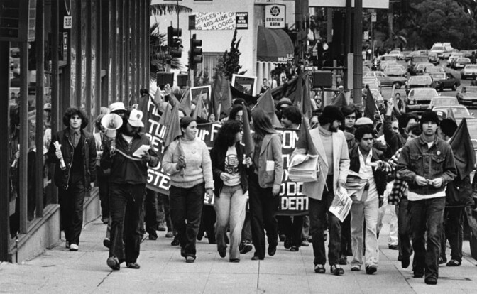 Millions of workers around the world observe May Day each year - the international holiday of organized labor. Like many before it, this May Day march along Wilshire Boulevard culminated in a rally at MacArthur Park, 1980.