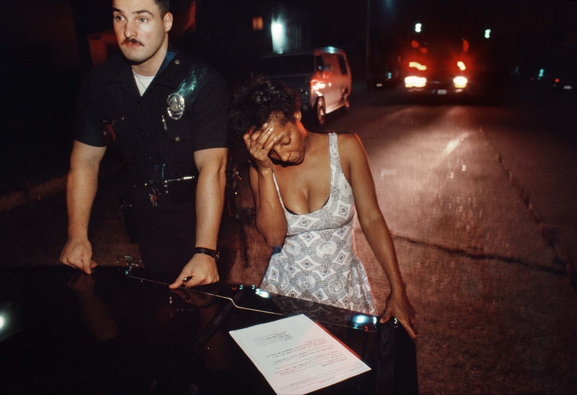 In South Central, a 77th Division officer asks a domestic violence victim to sign a restraining order against her boyfriend. | Joseph Rodriguez