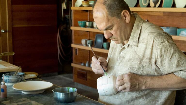 Jeff Oestreich decorates bisque ware