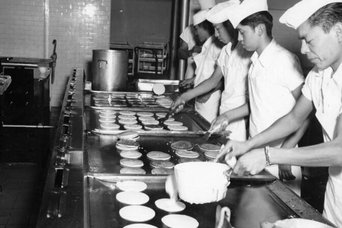 Young men preparing pancakes for Sherman Indian School students. Credit: Sherman Indian Museum.