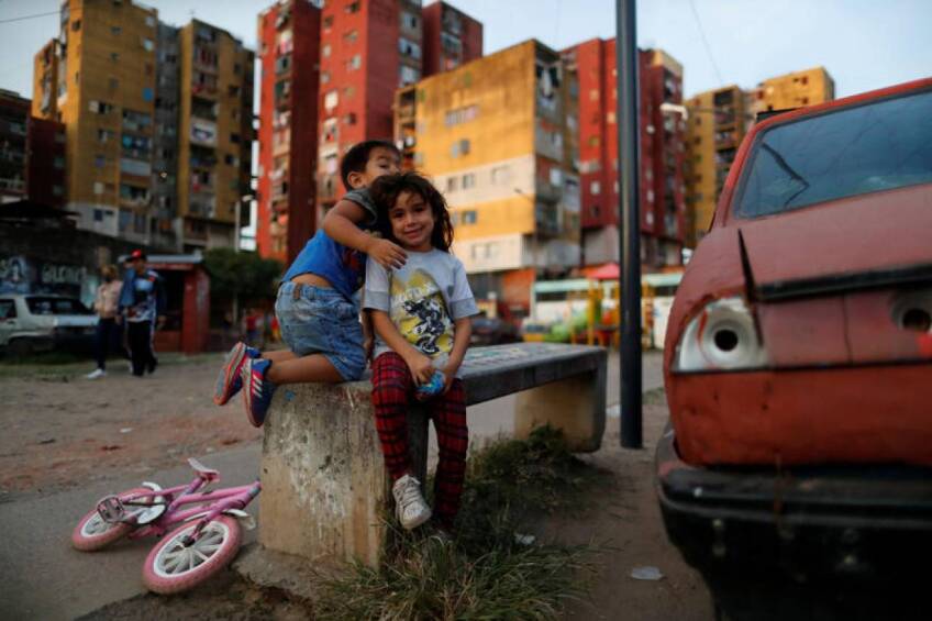 Children play during the spread of the coronavirus disease (COVID-19), at Fuerte Apache, on the outskirts of Buenos Aires, Argentina April 23, 2020. | REUTERS/Agustin Marcarian