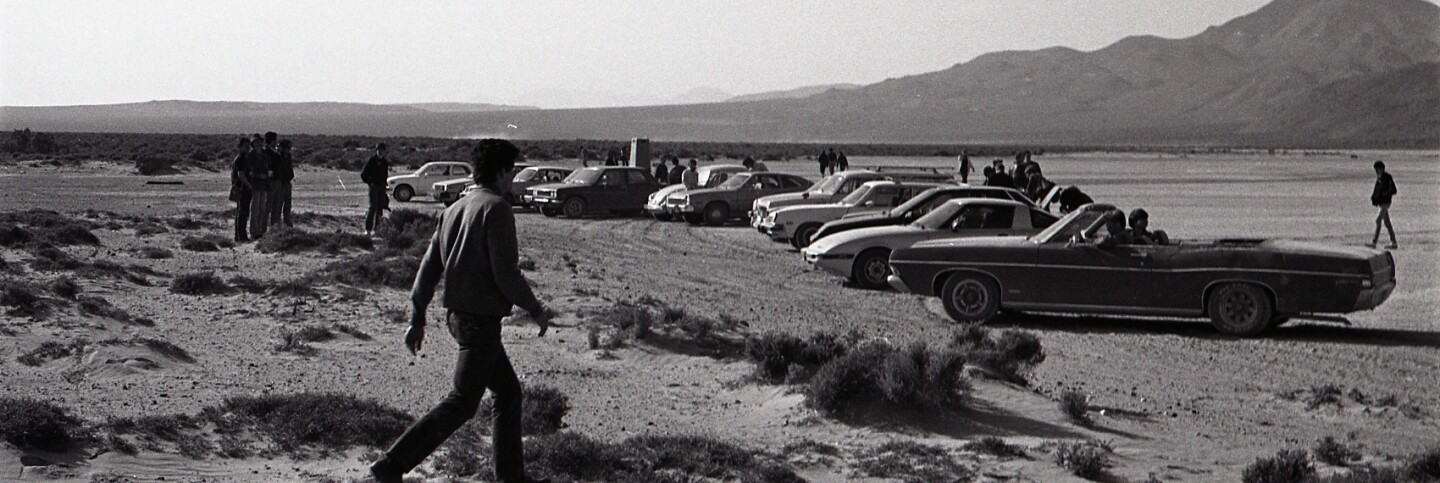 Parked cars, Desolation Center: Mojave Exodus, 1983 | Dan Voznick