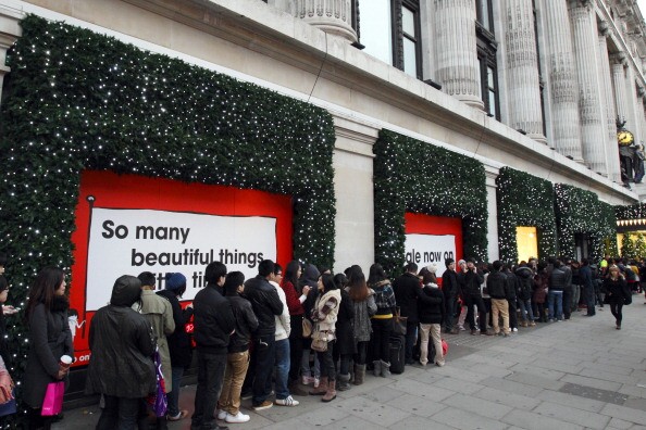 Long Christmas shopping lines, seen here in London, is ubiquitous. Inglewood, CA is no different. | JUSTIN TALLIS/AFP/Getty Images