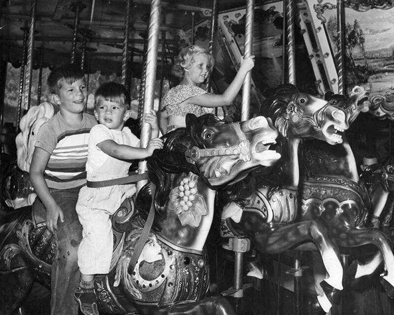 Two boys on the Griffith Park Merry-Go-Round| Dean Musgrove, Herald Examiner Collection, Los Angeles Public Library