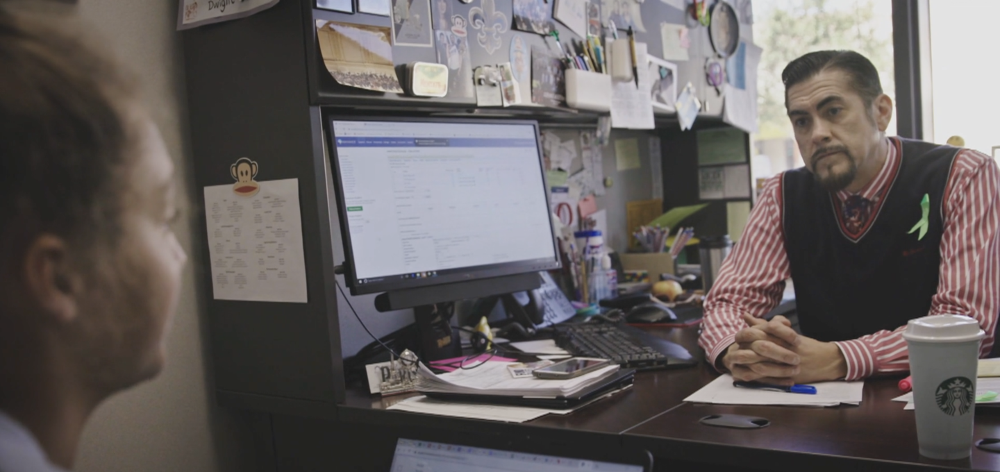 Dwight Schmidt, school counselor, talking to student | Still from "Under Pressure"