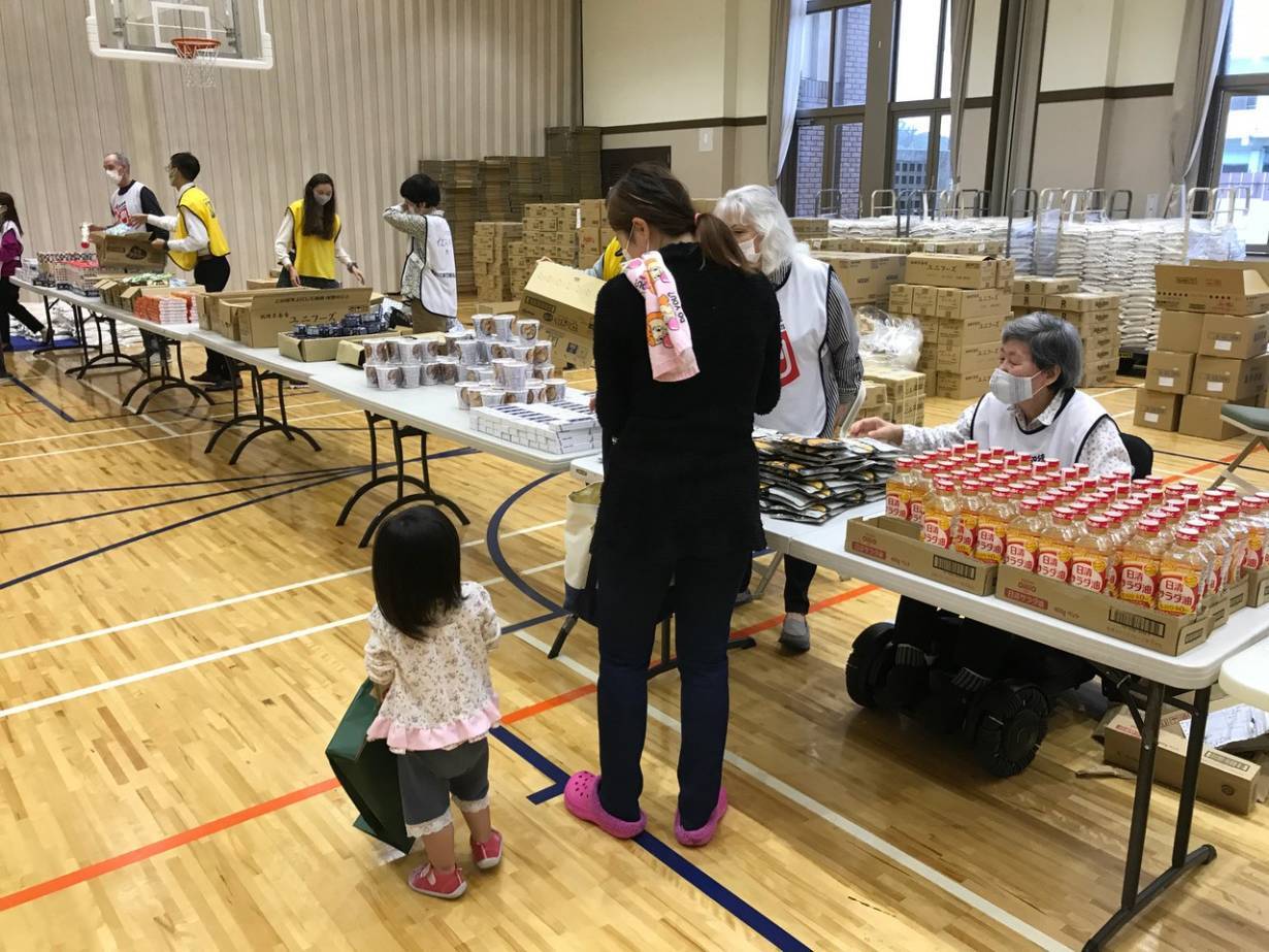 Volunteers handle food donations in Tokyo, Japan