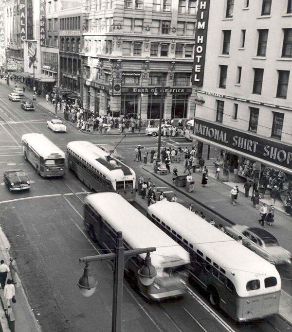 Seventh and Broadway circa 1956. Buses and streetcars share the road with pedestrians and automobiles. Courtesy of the Metro Transportation Library and Archive. Used under a Creative Commons license.