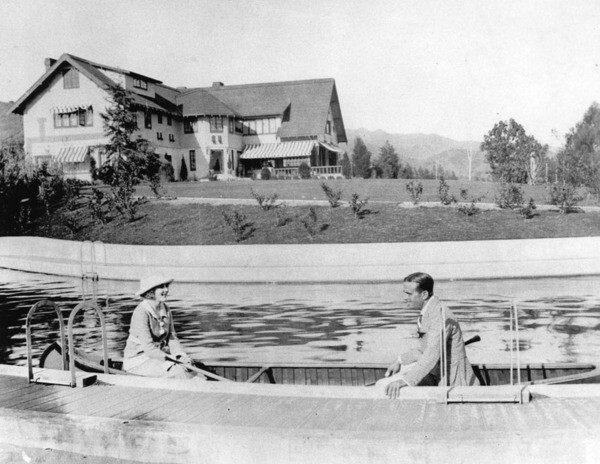 Mary Pickford and Douglas Fairbanks canoeing in the swimming pool at Pickfair. Courtesy of the Los Angeles Public Library