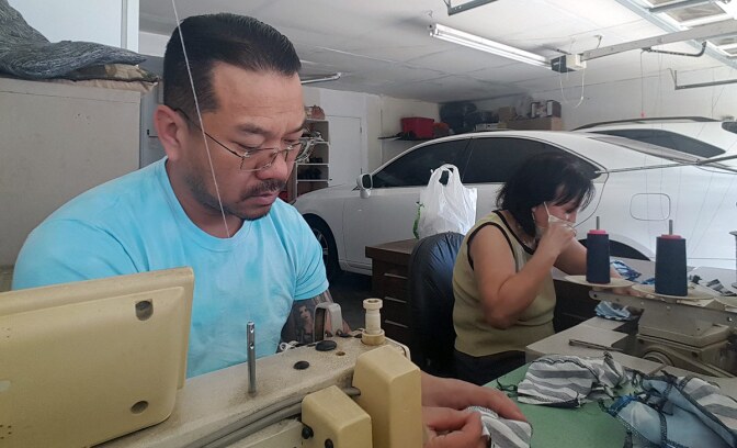 Uncle Van Huynh sews masks for the Auntie Sewing Squad with his mom. | Sam Huynh