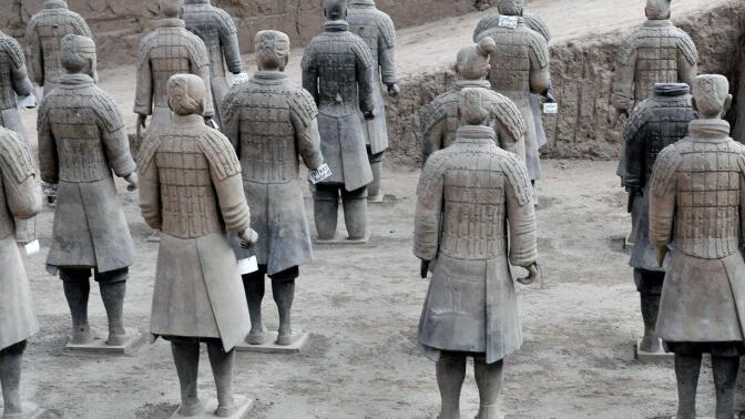 The Terracotta Army from China line up side by side.