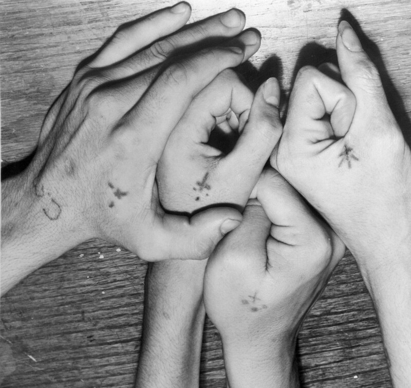 Hands of gang members. Four prisoners at the Chicago County Jail display tattoos like the markings worn by some Pachucos, 1954.