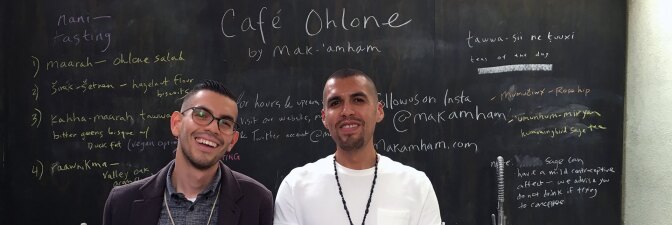 Louis Trevino (left) and Vincent Medina (right) stand in front of their Café Ohlone chalkboard menu. | Momo Chang
