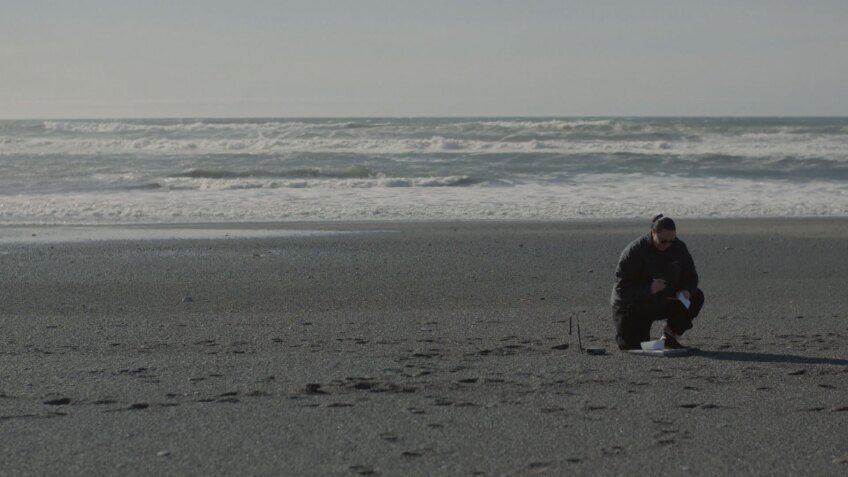 Rosa Laucci, a tribal marine biologist, collects data to monitor for smelt presence on the beach. | Still from "Tending Nature"