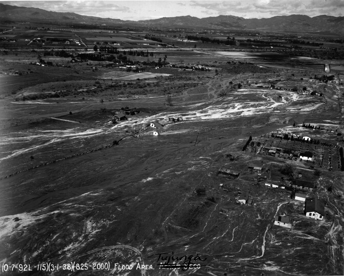Houses caught in a flooded Tujunga Wash in March 1938