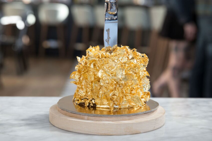 Jumbo Apple dessert enveloped in gold leaf from Kimpton Everly Hotel