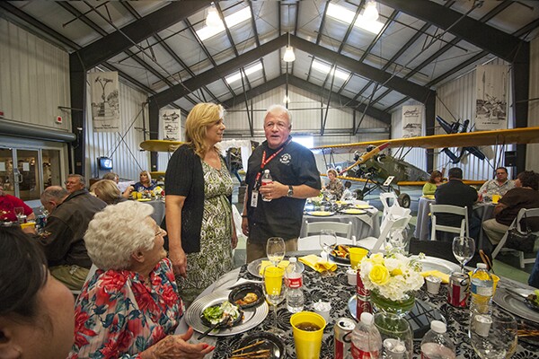 Kim Bartholomy and Mikey Diaz stand at their ambush wedding reception. | Photo: Douglas McCulloh