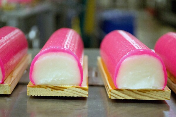 Traditionally pink dye is added to the edge of the kamaboko and is placed on a wooden plank | Photo by Sarah Silcox