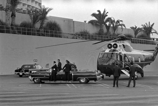 President Lyndon B. Johnson transfers from helicopter to limousine in Century City, hours before march would nearly lead to his emergency evacuation. Courtesy of the Los Angeles Times Photographic Archive, Young Research Library, UCLA.