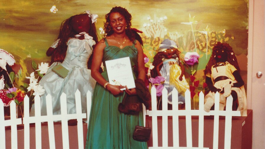Artist Teresa Tolliver and her installation at a William Grant Still Art Center Black Doll Show, circa 87-90 | Bobbie Campbell, Courtesy of William Grant Still Art Center