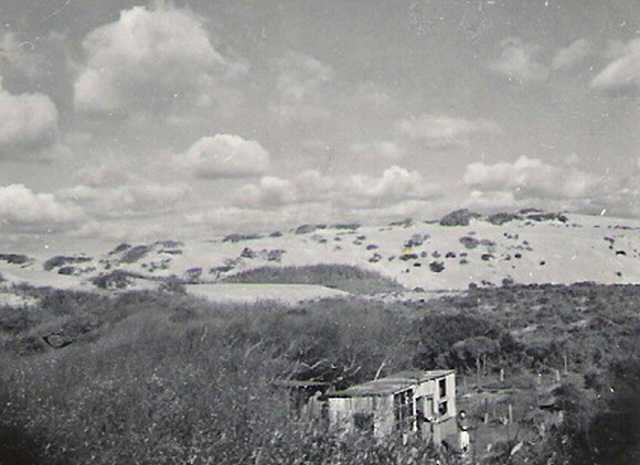 Elwood Decker stands in front of his cabin in the Oceano Dunes in 1943. | Photo by Sal Ganci, courtesy of Norm Hammond.