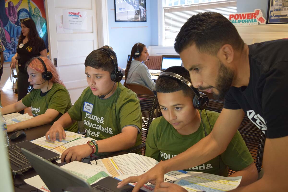 Power California Field Director Mynor Godoy assists volunteer phone bankers at a GOTV event in Los Angeles in February 2020 | Jay Banks