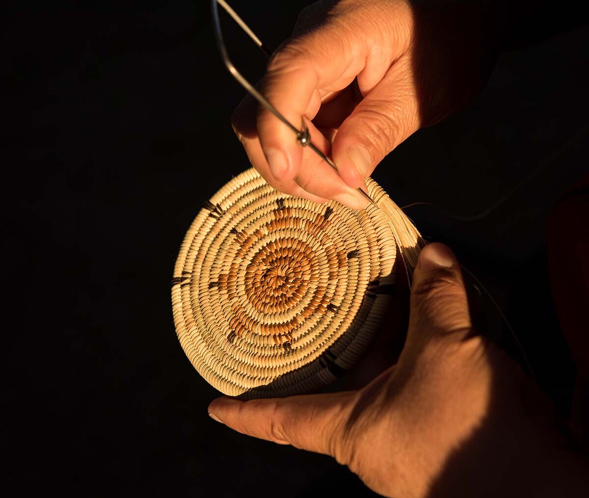 Maria de los Angeles Carillo using an awl | Rose Ramirez