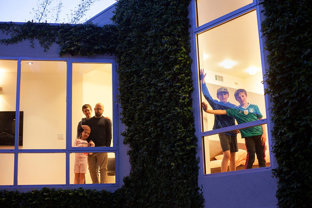 Photographer Sally Ryan snapped pictures of her neighbors with a window separating the camera from the people to symbolize social distancing. | Photographs by Sally Ryan and submitted to the Autry.