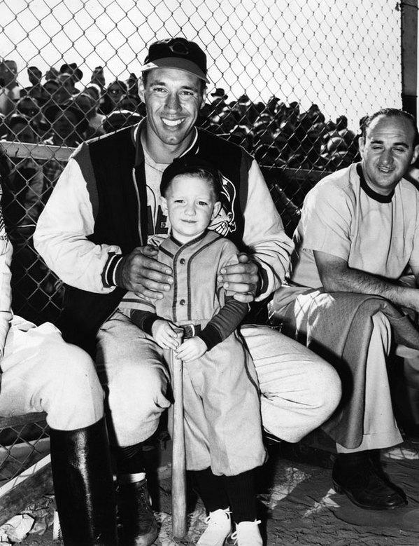 A child poses with Cleveland Indians pitcher Bob Feller at Burbank's Olive Memorial Stadium in 1949. Courtesy of the Herald-Examiner Collection, Los Angeles Public Library.