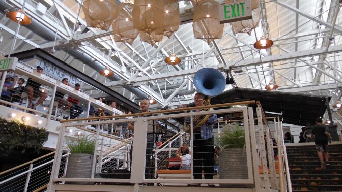 Two people perform at the Anaheim Packing House.
