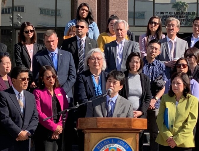 Robin Toma, executive director of the L.A. County Commission on Human Relations, joins other county officials and community leaders to speak out against coronavirus-related racism. | Josie Huang/LAist