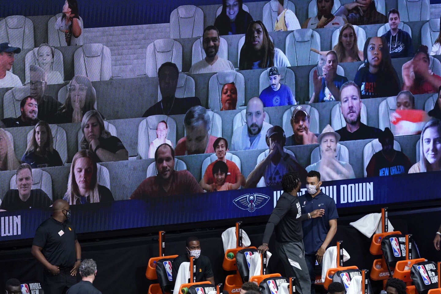 Photos of fans are seen on screens during the second half of an NBA game between the New Orleans Pelicans and the Utah Jazz at HP Field House at ESPN Wide World Of Sports Complex on July 30, 2020 in Reunion, Florida.