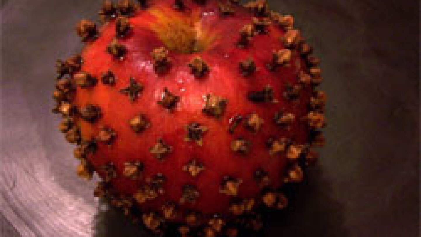 an apple studded with cloves makes the season bright