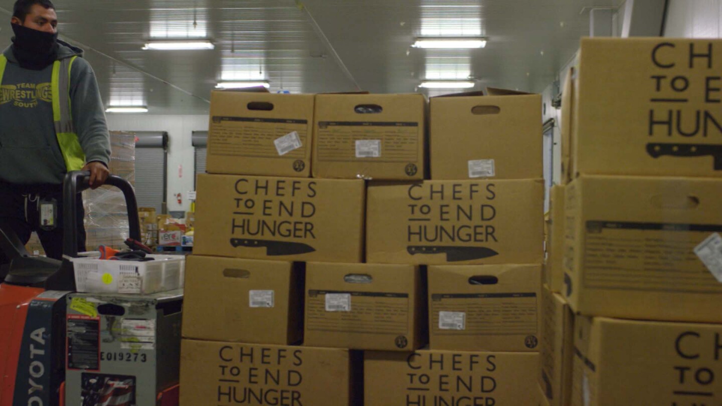 Boxes of recovered food donated by restaurants and hotels to Chefs to End Hunger. | Still from "Broken Bread"